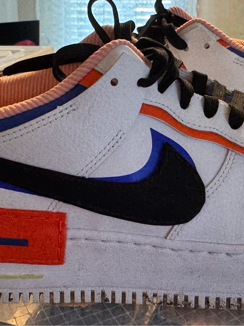 Nike Kids White Sneakers with Black Swoosh and Pink Accents